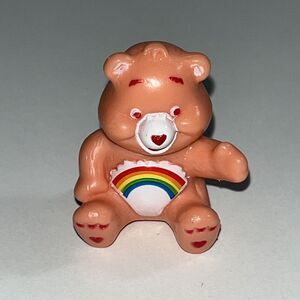 Pink Care Bear Figurine With Rainbow